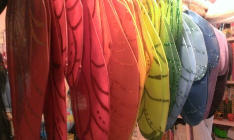 After being painted and sparkled, the fairy wings are hanging around waiting for the next step.